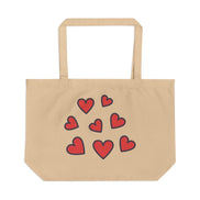 Beige tote bag with red hearts on a white background