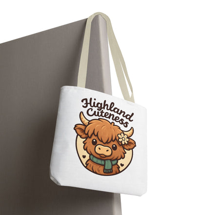 Tote bag with a cartoon highland cow and 'Highland Cuteness' text on a white background