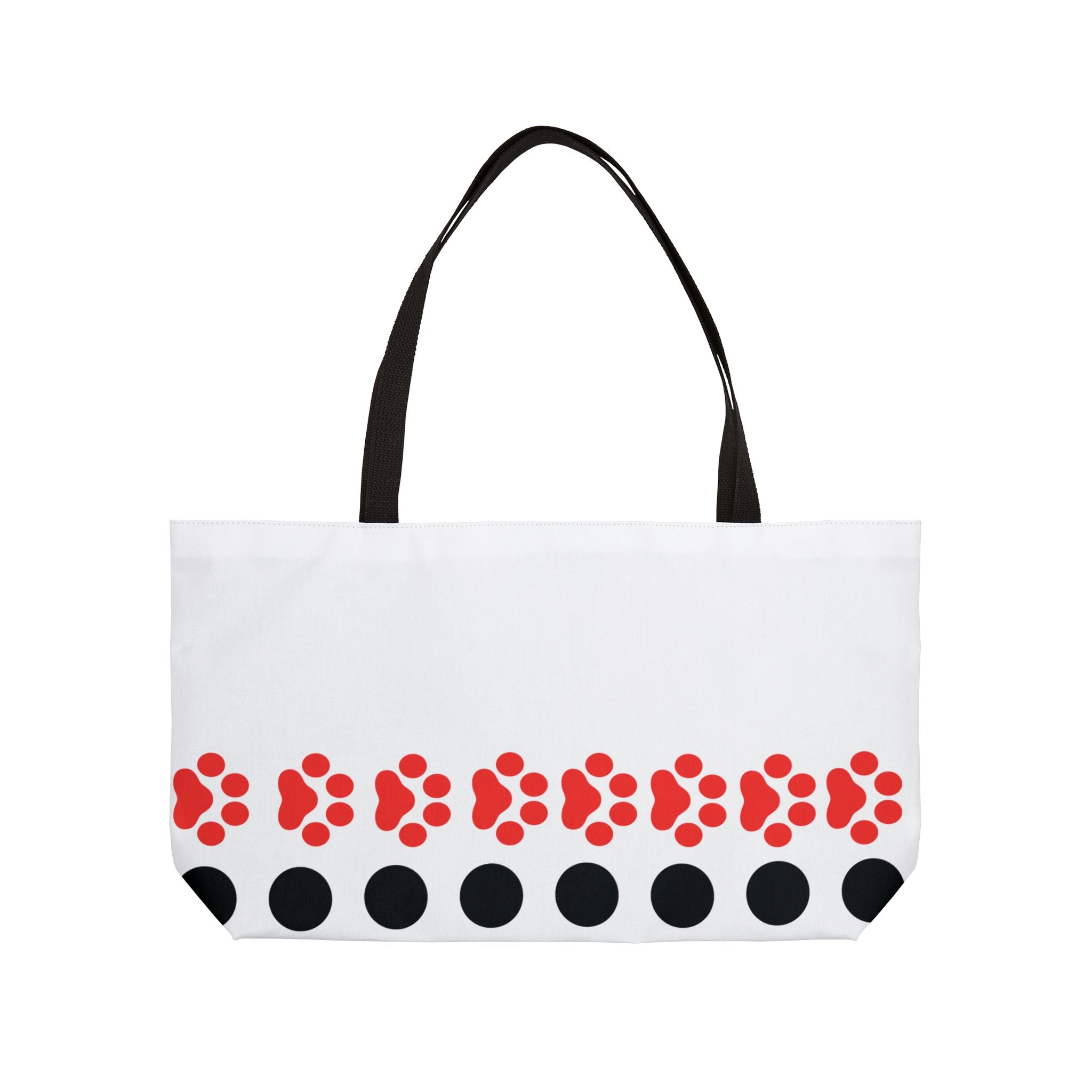 White tote bag with red paw prints and black accents on a white background