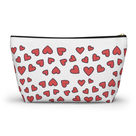 White pouch with red heart pattern on a white background