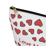 Pouch with red heart pattern and 'Love Me' text on a white background