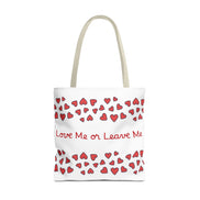 Tote bag with red heart pattern and text 'Love Me or Leave Me' on a white background