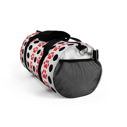 Duffel bag with paw print pattern on a white background