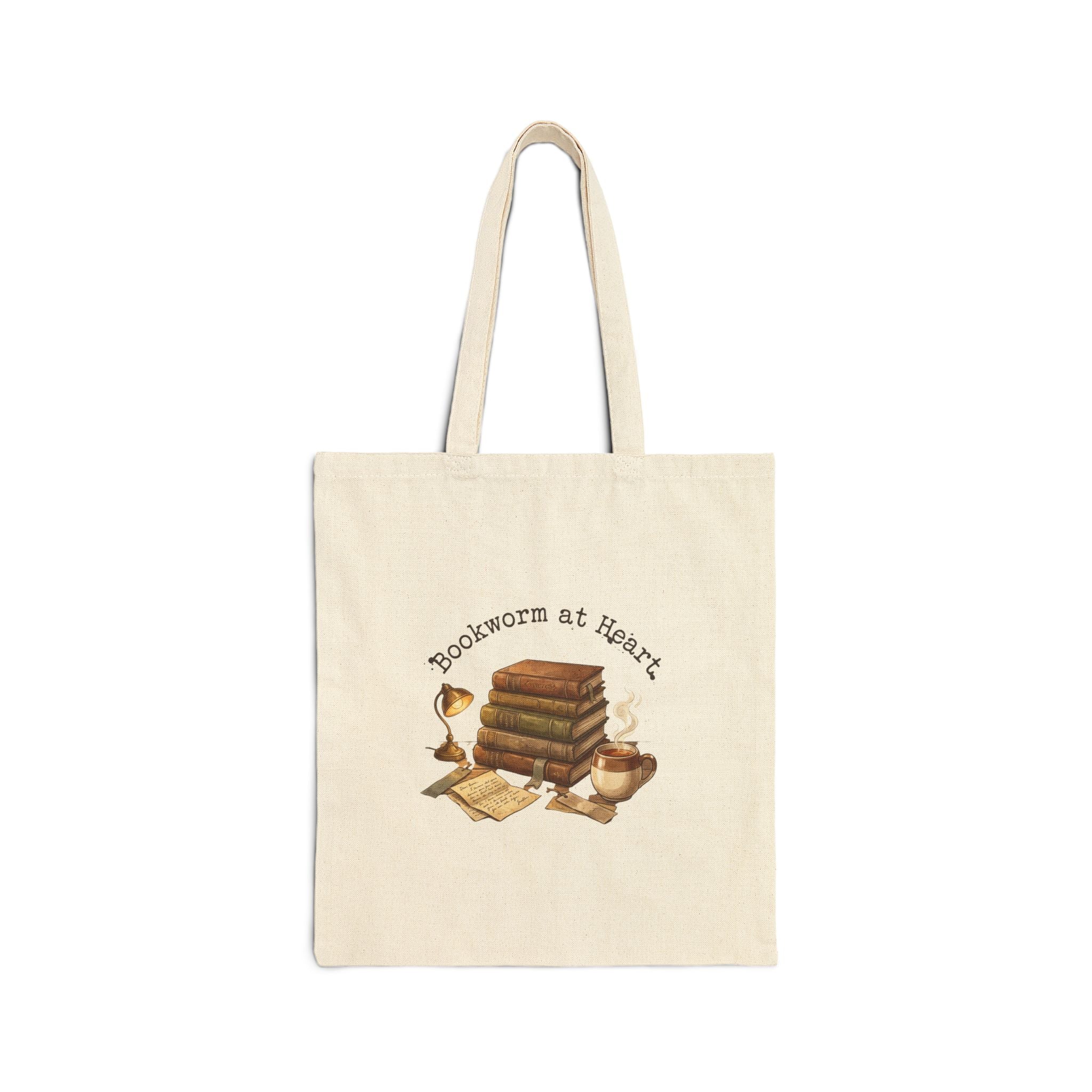 Beige tote bag with 'Bookworm at Heart' text and book-themed design on a white background