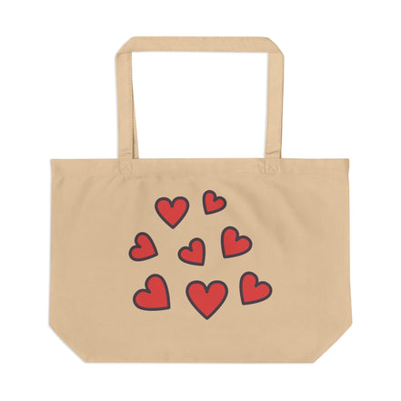 Beige tote bag with red heart designs on a white background