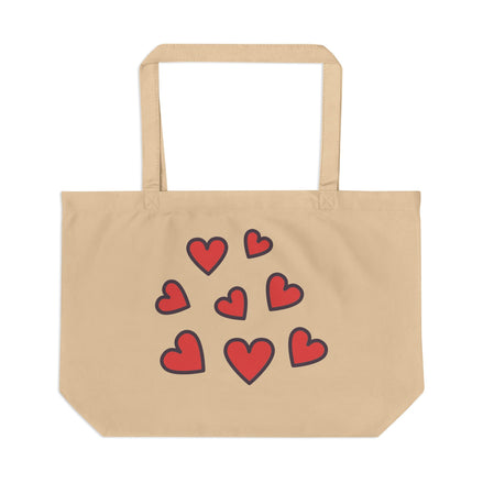 Beige tote bag with red heart designs on a white background