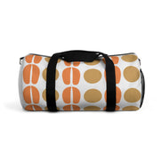 Duffel bag with orange and brown abstract pattern on a white background