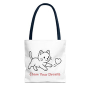 Tote bag with a dark blue handle and cat illustration and 'Chase Your Dreams' text on a white background