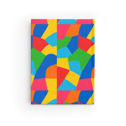 Colorful geometric patterned notebook on a white background