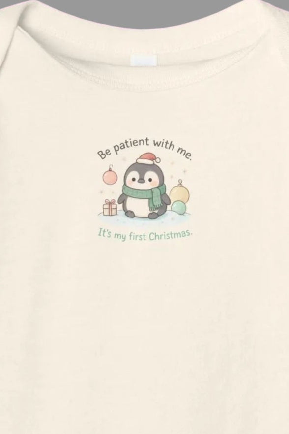 Baby onesie with a cartoon penguin design on a white background