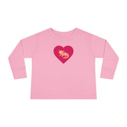 Pink long-sleeve shirt with a red heart and yellow character on a white background