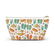 Pouch with beach-themed pattern featuring flip-flops, sandcastles, and drinks on a white background