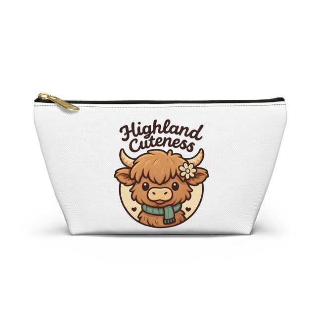 White pouch with a cartoon highland cow and 'Highland Cuteness' text on a white background