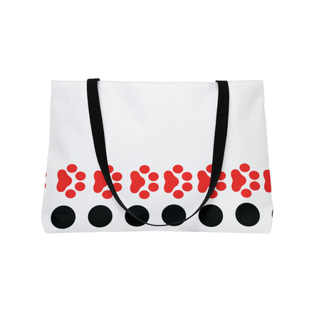 White tote bag with red paw prints and black circles on a white background
