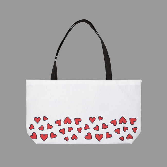White tote bag with red heart pattern on a white background