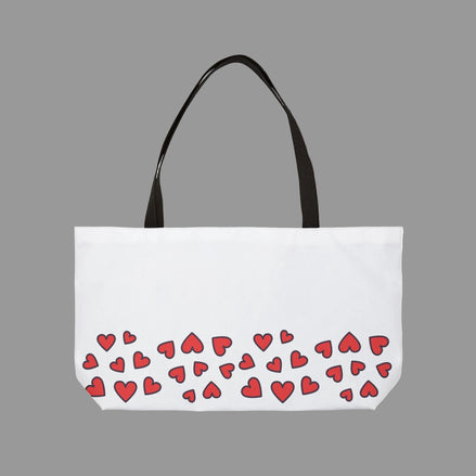 White tote bag with red heart pattern on a white background