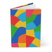 Colorful geometric patterned notebook on a white background