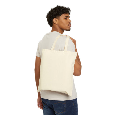 Man carrying a beige tote bag on a white background