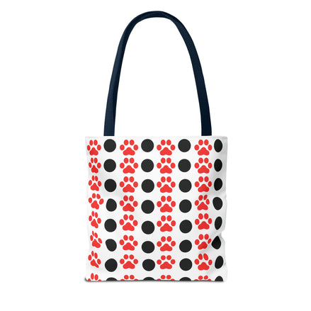 Tote bag with red and black paw print pattern on a white background
