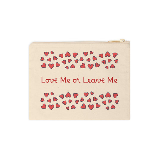 Beige pouch with red hearts and text 'Love Me or Leave Me' on a white background