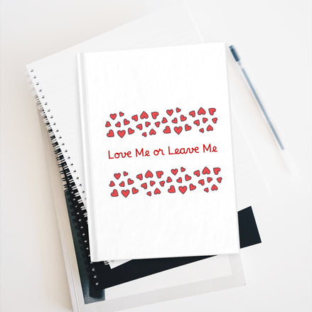 Notebook with 'Love Me or Leave Me' text and heart pattern on a white background