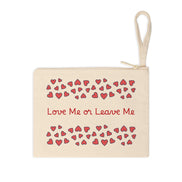 Beige pouch with red hearts and 'Love Me or Leave Me' text on a white background