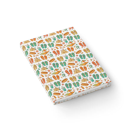 Notebook with a colorful beach-themed pattern on a white background