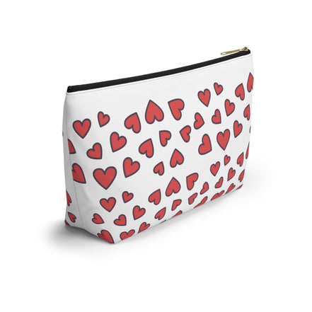 White pouch with red heart pattern on a white background