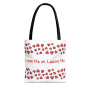 Tote bag with red hearts and text 'Love Me or Leave Me' on a white background