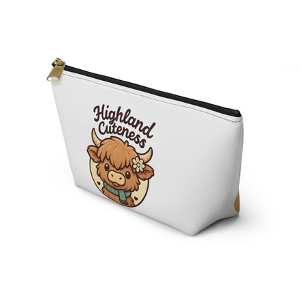 White pouch with a cartoon highland cow and 'Highland Cuteness' text on a white background