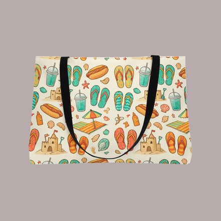 Beige tote bag with beach-themed pattern featuring flip-flops, sandcastles, and umbrellas on a white background.