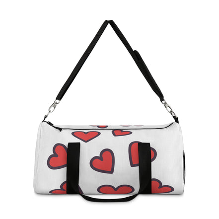 White duffel bag with red heart patterns and black handles on a white background