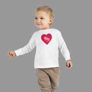 Axolotl heart toddler long sleeve tee pink salamander design kids shirt. Child wearing a white long-sleeve shirt with a pink heart design on a white background