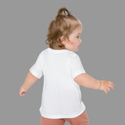 Child wearing a white t-shirt on a white background