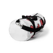 White duffel bag with black straps on a white background