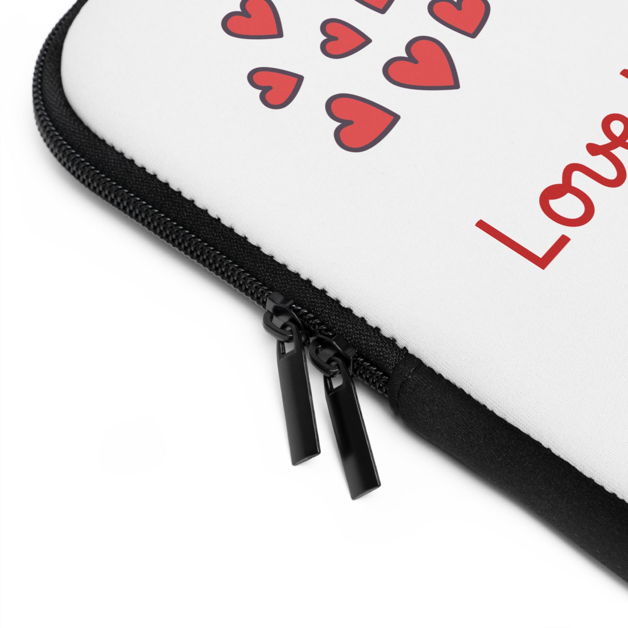 Close-up of a product with red hearts and the word 'Love' on a white background.