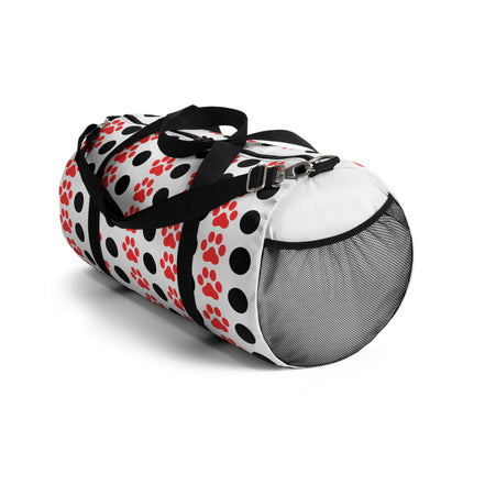 Pet carrier with black, white, and red paw pattern on a white background