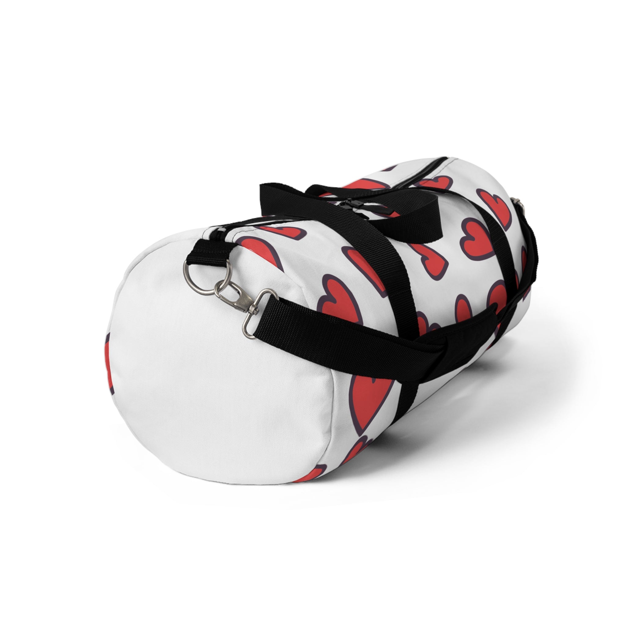 White duffel bag with red heart pattern and black straps on a white background