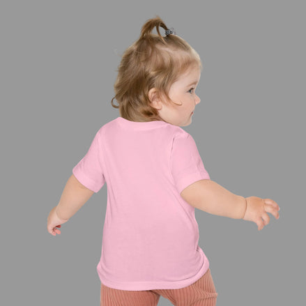 Child wearing a pink shirt on a white background