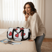 a woman smiles slyly and puts her finger over her mouth to say hush she leans over a duffel printed with hearts and cruise tickets
