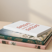 Stack of books with various covers on a light surface